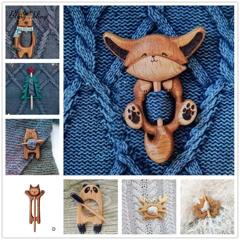 A display of wooden cartoon animal brooch pins featuring fox, cat, panda, Christmas tree, and crab designs